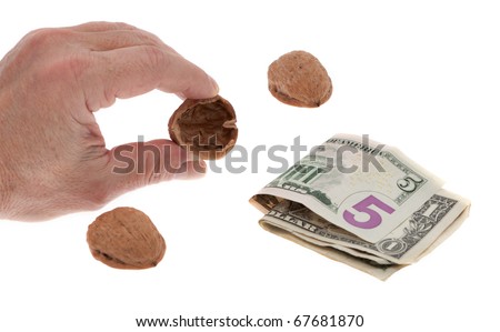 Shell game with money in front of white background