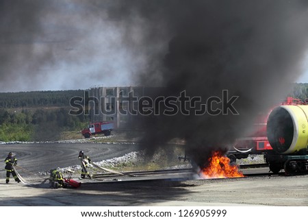 NIZHNY TAGIL, RUSSIA- AUG 23: Demonstration of work of firemen, the fire was extinguished by the railway at the exhibition RUSSIAN DEFENCE EXPO 2012 on August, 23, 2012 in Nizhny Tagil, Russia