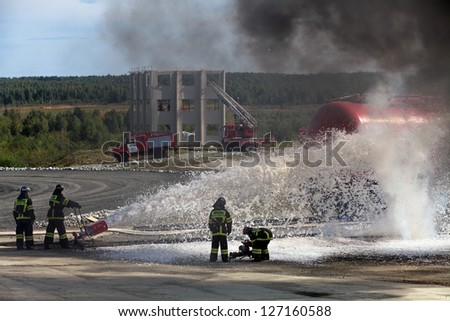 NIZHNY TAGIL, RUSSIA- AUG 23: Demonstration of work of firemen, the fire was extinguished by the railway at the exhibition RUSSIAN DEFENCE EXPO 2012 on August, 23, 2012 in Nizhny Tagil, Russia