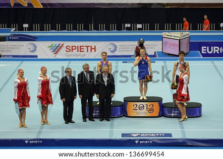 MOSCOW - APR 21: 2013 European Artistic Gymnastics Championships. Awarding of winners in Vault - Denis Ablyazin, Flavius Koczi and Artur Davtyan in Olympic Stadium on April 21, 2013 in Moscow, Russia