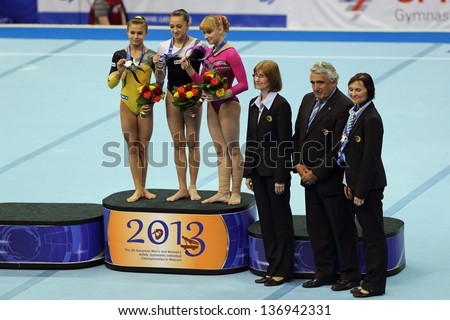 MOSCOW - APR 21: 2013 European Artistic Gymnastics Championships. Winners Balance Beam -  Larisa Iordache,  Diana Bulimar and Anastasia Grishina in Olympic Stadium on April 21, 2013 in Moscow, Russia