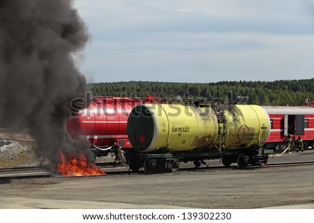 NIZHNY TAGIL, RUSSIA- AUG 23: Demonstration of work of firemen, fire train arrived at the site of the fire at the exhibition RUSSIAN DEFENCE EXPO 2012 on August, 23, 2012 at Nizhny Tagil, Russia
