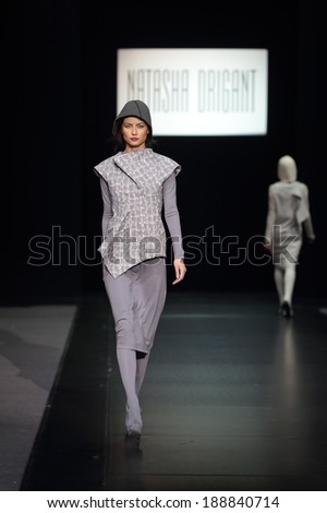 MOSCOW, RUSSIA - APR 03, 2014: Moscow Fashion Week in Gostiny Dvor. Demonstration models of clothes on the catwalk from French designer Natasha Drigant