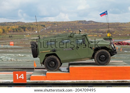 NIZHNY TAGIL, RUSSIA - SEP 26, 2013: The international exhibition of armament, military equipment and ammunition RUSSIA ARMS EXPO (RAE-2013). GAZ Tigr is a Russian 4x4 infantry mobility vehicle