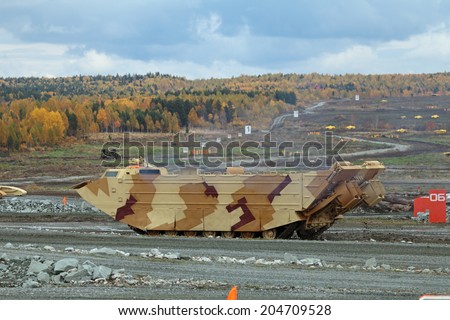 NIZHNY TAGIL, RUSSIA - SEP 26, 2013: The international exhibition of armament, military equipment and ammunition RUSSIA ARMS EXPO (RAE-2013). Amphibious Carrier production Uralvagonzavod (UVZ)