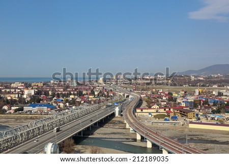 SOCHI, ADLER, RUSSIA - FEB 24, 2014: The rail and road bridges across the river Mzymta in Adlersky District Sochi, venue for the 2014 winter Olympics, top view