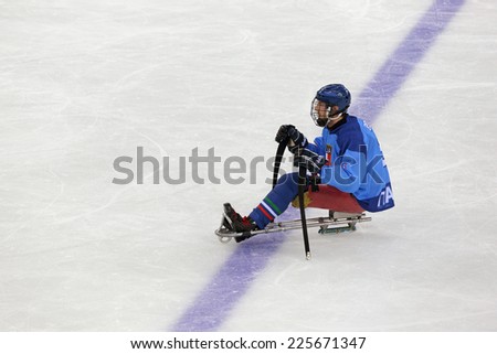 SOCHI, RUSSIA - MAR 12, 2014: Paralympic winter games in ice Arena Shayba. The sledge hockey, match Italy-Sweden. The Italian team player