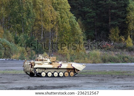 NIZHNY TAGIL, RUSSIA - SEP 26, 2013: The international exhibition of armament, military equipment and ammunition RUSSIA ARMS EXPO (RAE-2013). Mobile reconnaissance post goes along the forest