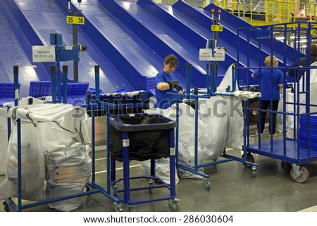 VNUKOVO, MOSCOW REGION, RUSSIA - APR 7, 2015: Russian Post. Logistics center in Vnukovo, working around conveyor