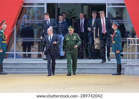 KUBINKA, RUSSIA - JUN 16, 2015: The President of Russia Vladimir Putin and Minister of Defense Sergey Shoygu at the International military-technical forum ARMY-2015 in military-Patriotic park