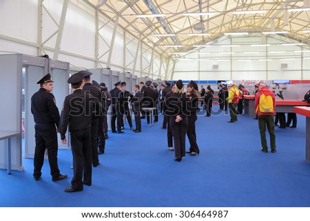 KUBINKA, MOSCOW OBLAST, RUSSIA - JUN 16, 2015: The screening visitors - police work at the International military-technical forum ARMY-2015 in military-Patriotic park.