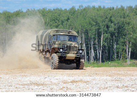 MILITARY GROUND ALABINO, MOSCOW OBLAST, RUSSIA - JUN 18, 2015: The demonstration of the capabilities of a military truck Ural-43206 at the International military-technical forum ARMY-2015