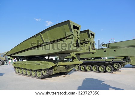 KUBINKA, MOSCOW OBLAST, RUSSIA - JUN 18, 2015: International military-technical forum ARMY-2015 in military-Patriotic park. The self-propelled bridge-laying tank MTU-90