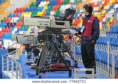 MOSCOW, RUSSIA - APR 28: An unidentified video operator video tapes the 2011 World Championship of Figure Skating at the Palace of sports \
