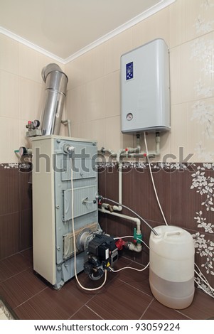 System of heating of a country house. Electric and universal boiler on liquid and solid fuel