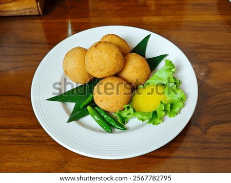 Similar – Foto Bild Gebratene Kroketten, serviert mit Saucen und Oliven