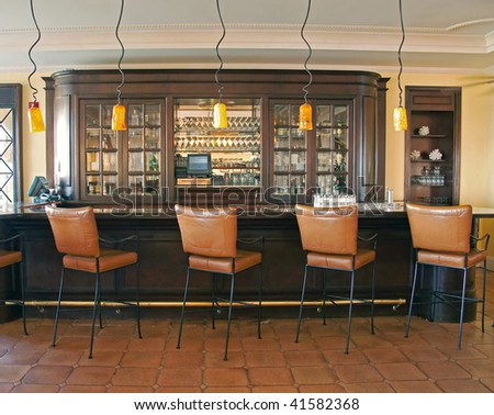 chic retro bar with leather chairs
