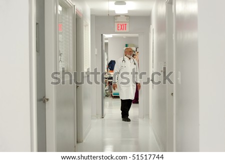 a vet walks down the corridors of a veterinary hospital