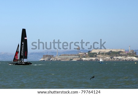 SAN FRANCISCO, CA - JUNE 21: America\'s Cup team Oracle racing practicing in AC 45 catamarans on June 21, 2011, San Francisco, CA. James Spithill\'s No. 4 passes Alcatraz Island.