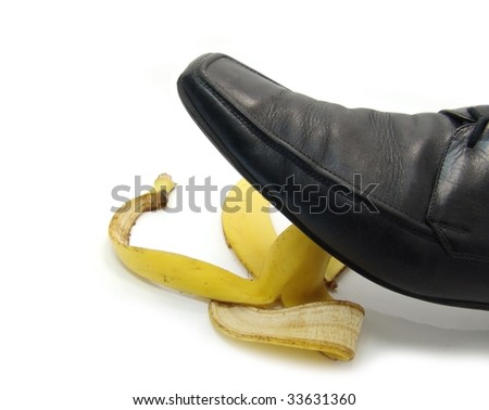 stock-photo-man-s-shoe-about-to-step-on-a-banana-skin-33631360.jpg
