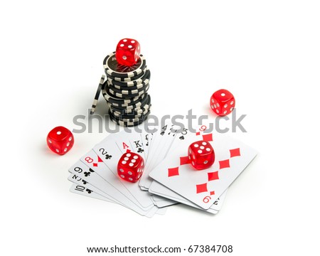 Poker chips stacked and dice and playing cards on a white background.
