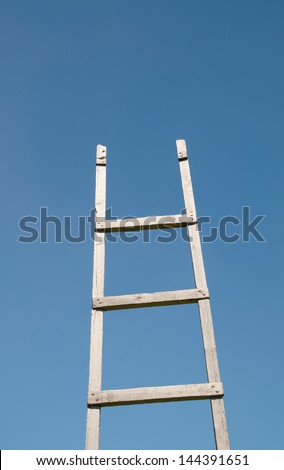Old antique ladder to blue heaven