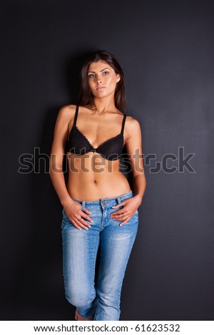 Attractive woman in jeans and bra
