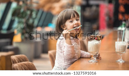 Similar – Image, Stock Photo portrait adorable child eating chocolate sponge cake