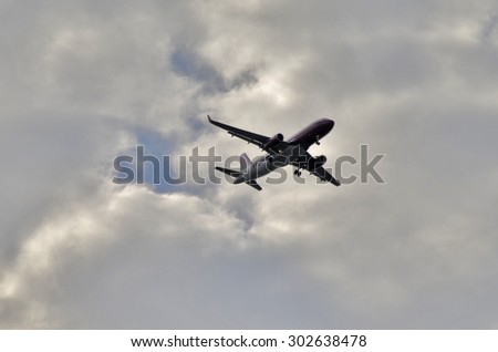 Otopeni AIRPORT, Romania - 1 Aug: Wizz air plane landing on Otopeni Airport on August 1, 2015. Wizz air is a low-cost airline