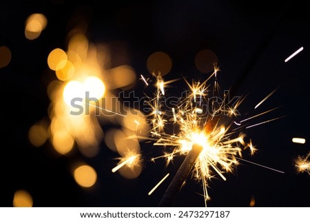 Similar – Image, Stock Photo Burning sparkler against black background