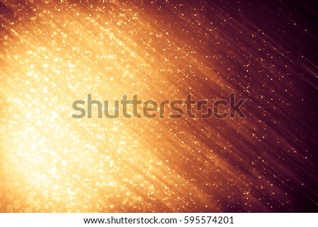 golden abstract sparkles or glitter lights festive gold background