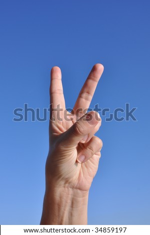 Woman hand, gesturing. Two fingers