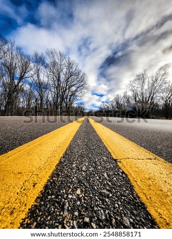 Similar – Image, Stock Photo yellow line which runs over different road surfaces