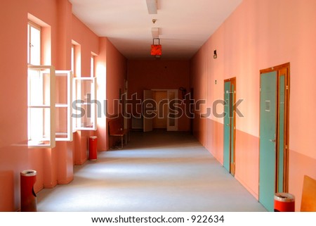 orange-red corridor (hallway) with blue doors