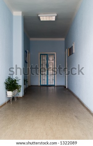 blue corridor (hallway) with white doors