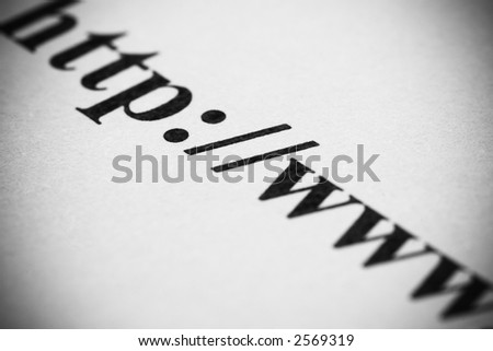Black and white macro shot of internet address printed on paper