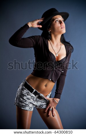 Glamor style photos of young woman with black hair, black hat on head