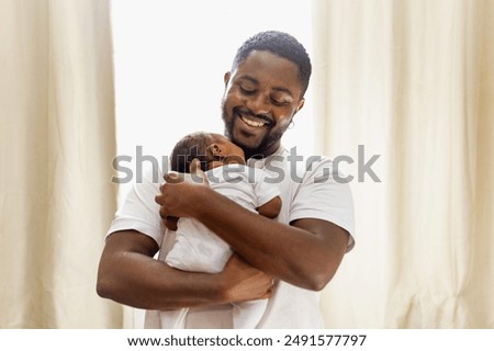 Similar – Image, Stock Photo Smiling black man in rings speaking on smartphone