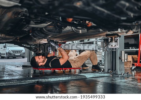 Similar – Image, Stock Photo Man lying down holding mirror with reflection