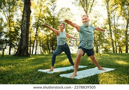 Image, Stock Photo Flexible man training on aerial straps