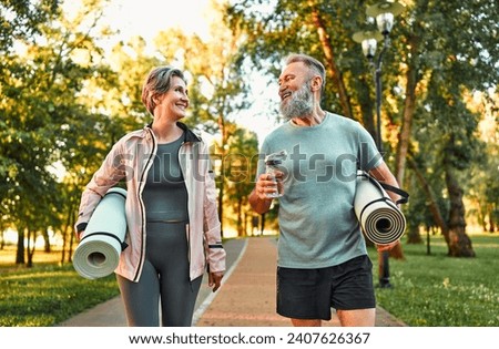 Image, Stock Photo fit senior lady dressed in black by the lake