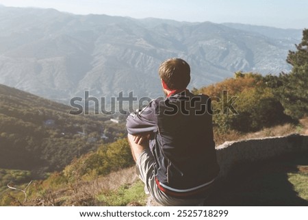 Similar – Image, Stock Photo Anonymous traveler admiring landscape of volcano under cloudy sky