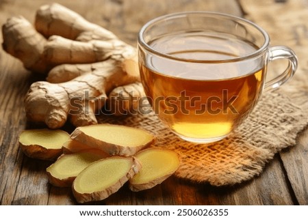 Similar – Image, Stock Photo Glass cup with ginger and lemon tea, on a yellow background along with its ingredients.