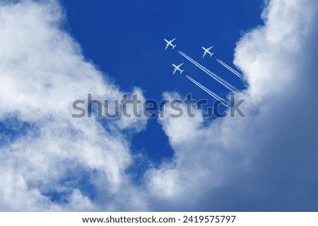 Similar – Image, Stock Photo Crossing contrails in the sky