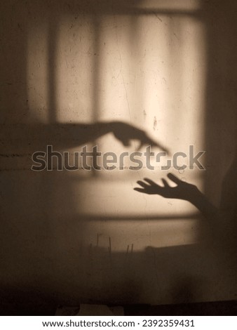 Similar – Image, Stock Photo Two shadows hands in red and green light circle.
