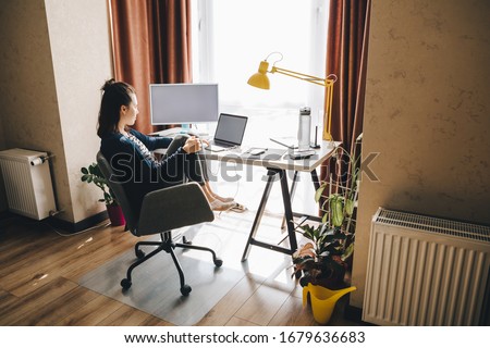 Photo of woman working at home. telework on laptop