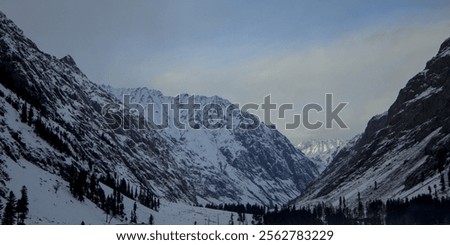 Similar – Image, Stock Photo Dark mountain range under cloudy sky in twilight