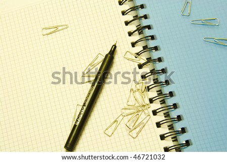 paper ckip and pen on notebook - easy blur for background