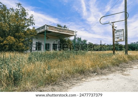 Similar – Image, Stock Photo Old dilapidated fuel pump for liquid fuel in detail with reflection of a blue oh so environmentally friendly xyz car