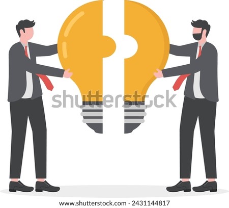 Business metaphor of a joint venture, partnership or teamwork. busines man putting together light bulb shaped puzzle.

